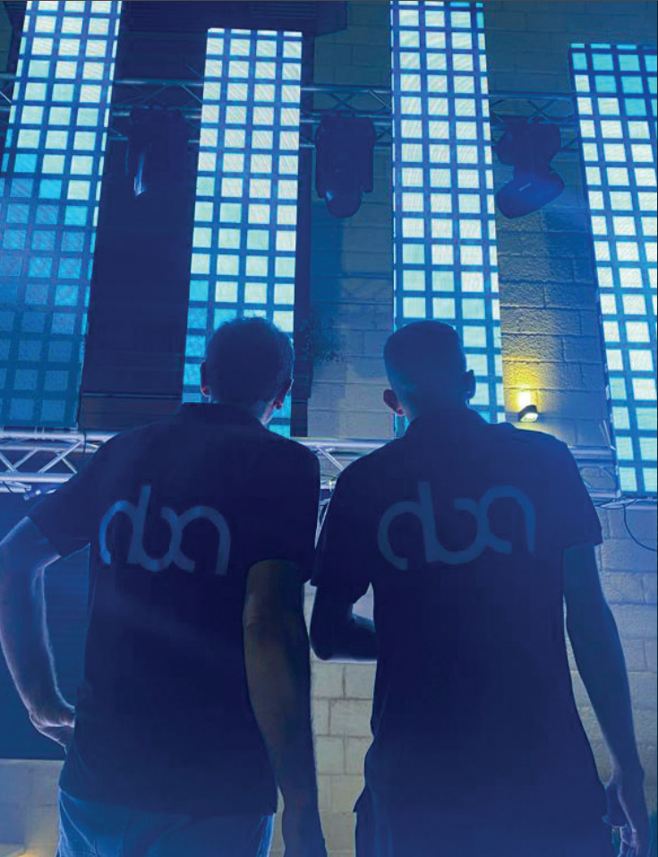 aba staff standing with backs turned admiring thier work